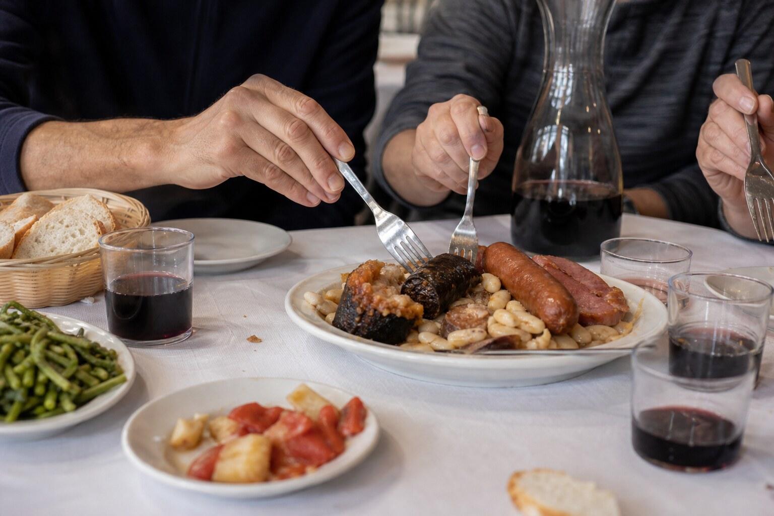 Diners sharing a substantial Catalan fork breakfast